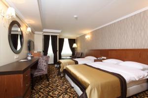 Postel nebo postele na pokoji v ubytování Arya Hotel Sakarya