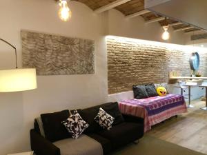 a living room with a couch and a table at Sweet Room Barcelona in Hospitalet de Llobregat