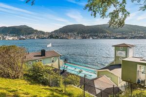 a view of a large body of water with houses at Dinbnb Apartments I Mid-City Luxury with Mini Balcony and Smart TV & Sound System in Bergen