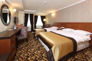 Postel nebo postele na pokoji v ubytování Arya Hotel Sakarya