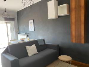 a living room with a couch and a table at Lovely Home in Avezzano