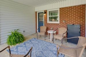 a porch with chairs and a table and a window at Greensboro Vacation Rental 2 Mi to Downtown! in Greensboro