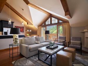 a living room with a couch and a table at The Sebastian - Vail in Vail