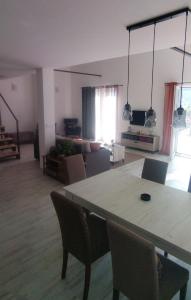 a large living room with a table and chairs at Guesthouse Nikoleta 2 in Kotor
