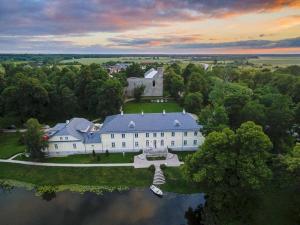 an aerial view of a large house on a lake at Külaliskorter in Padise