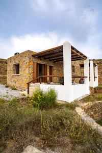 a stone house in the middle of a field at Saint Nicholas Resort - Villas in Kithnos