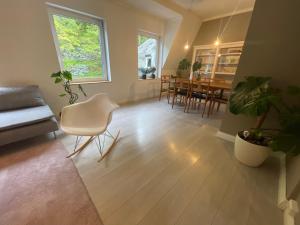 a living room with a couch and a table at Charming apartment in Ålesund center with free parking in Ålesund