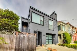 a gray house with a wooden fence at Charming 1 Br Apt Near Ocean & Sutro Heights Park in San Francisco