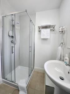 a bathroom with a shower and a sink at New room with free minibar&tea&coffee in Dublin