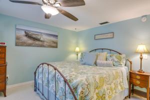 a bedroom with a bed and a ceiling fan at Canalfront Home with Dock and Pool 5 Mi to Ft Myers! in North Fort Myers +22 photos
