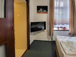 TV a/nebo společenská místnost v ubytování Pension City