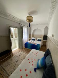 Postel nebo postele na pokoji v ubytování Riad magnolia privé