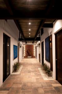 a hallway of a building with a wooden ceiling at Hotel Casa Cantera in Oaxaca City