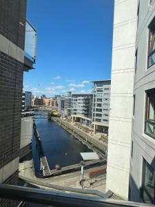 a view of a river from a building at Sugarhill Leeds docks in Leeds