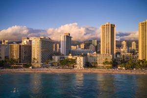 a view of a city with a beach and buildings at Moana Surfrider, A Westin Resort & Spa, Waikiki Beach in Honolulu