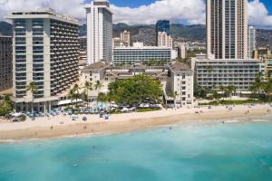 an aerial view of a beach in front of a city at Moana Surfrider, A Westin Resort & Spa, Waikiki Beach in Honolulu