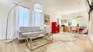 a living room with a couch and a table at El Cielo by Villa Alejandro in Boquete