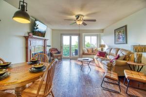 a living room with a table and a couch at Breathtaking Sunsets, Views, Pool, Heaven Awaits! in Gatlinburg