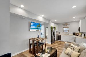 a living room with a couch and a table at Wellington Garden in West Palm Beach