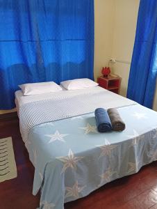 a bedroom with a bed with two towels on it at Mishra Residence in Suva