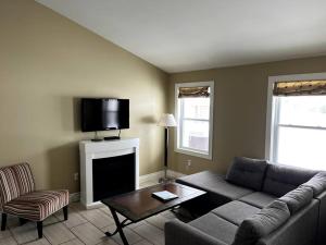 a living room with a couch and a flat screen tv at Home Away From Home in Stanley Bridge