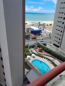 a view of the beach from the balcony of a hotel at Residence Porto de Iracema in Fortaleza