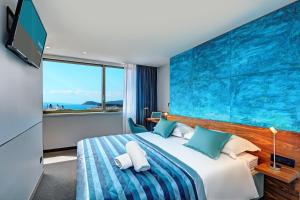 Postel nebo postele na pokoji v ubytování Horizon Luxury Suites & Design Rooms