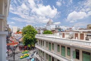 a view of a city street with cars and buildings at Exoresidence The Heart of Chinatown in Bangkok