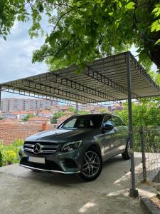 a car parked under a carport with a canopy at Apartment in Shtip in Štip