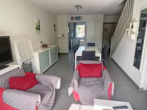 a living room with two couches and a dining room at Villa Idéale avec Piscine Chauffée à 1500m des Plages, 3 Chambres et Parking, Argelès-sur-Mer - FR-1-732-31 in Argelès-sur-Mer