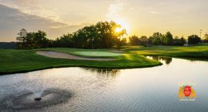 a view of a golf course with a pond at King's Inn Mason,Ohio in Cincinnati