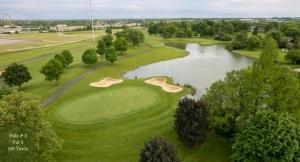 an aerial view of a golf course with a lake at King's Inn Mason,Ohio in Cincinnati