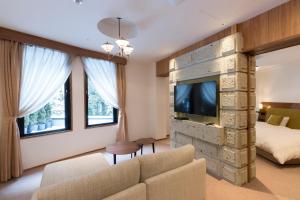 TV a/nebo společenská místnost v ubytování Nikko Nishimachi Club