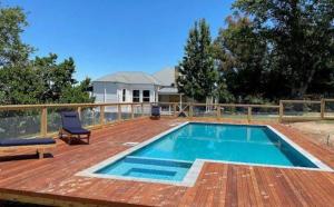 a swimming pool on top of a wooden deck at Mansfield Manor in Barwite
