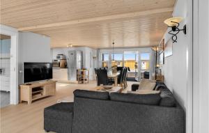 a living room with a couch and a table at Amazing Home In Slagelse With Wifi in Slagelse