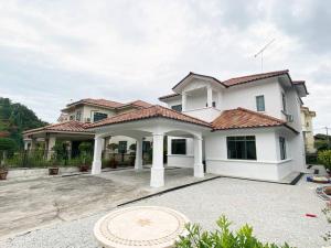 a large white house with a large driveway at Nestle Homestay@Batu Pahat in Batu Pahat