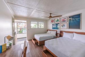 Ένα ή περισσότερα κρεβάτια σε δωμάτιο στο SCP Hilo Hotel