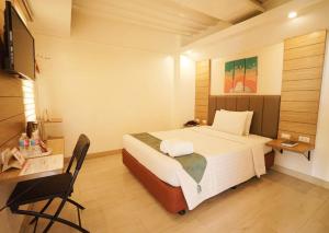 Ένα ή περισσότερα κρεβάτια σε δωμάτιο στο Chambre Hotel Mactan
