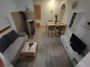a living room with a couch and a table at Apartment Matea in Senj