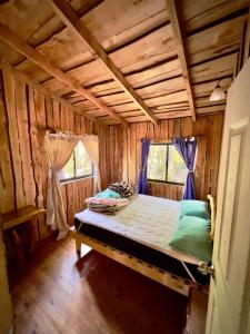 Llit o llits en una habitació de Cabañas Juan Bautista