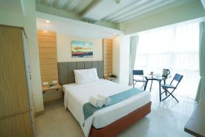 Ένα ή περισσότερα κρεβάτια σε δωμάτιο στο Chambre Hotel Mactan