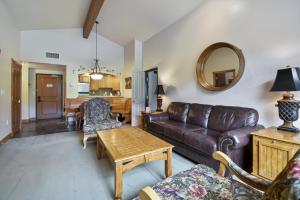 a living room with a couch and a table at Adventure Hub-Ski Resorts, Backcountry & Park City 3011 villa in Midway