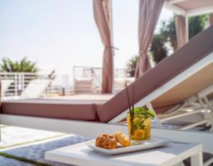 a plate of food on a table on a patio at Relais al Castello in Castellammare di Stabia