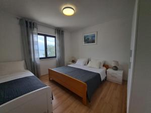 Postel nebo postele na pokoji v ubytování Villa Sirius