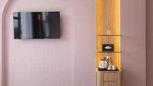 Příslušenství pro přípravu čaje a kávy v ubytování Wellesley Hotel