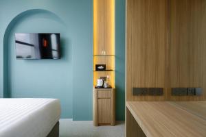 Postel nebo postele na pokoji v ubytování Wellesley Hotel