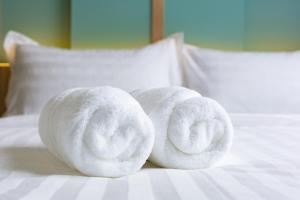Postel nebo postele na pokoji v ubytování Wellesley Hotel