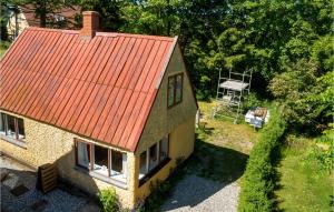 an overhead view of a house with an orange roof at 2 Bedroom Amazing Home In Sams in Permelille