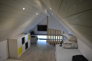 a room with a bed in a tent at Maison & studio 14 pers avec piscine privée sécurisée in Sampzon