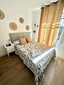 En eller flere senge i et værelse på Casa Secunda Romar